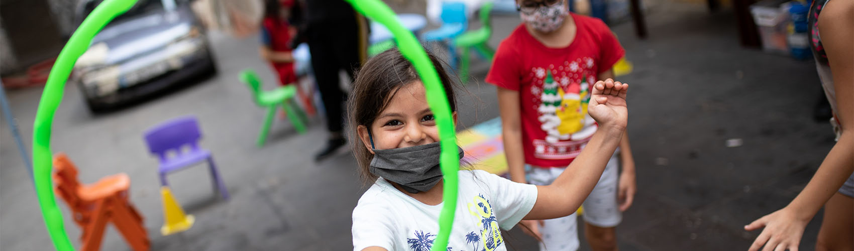 A little girl in Beirut, Lebanon plays in a child safe space sponsored by Save the Children